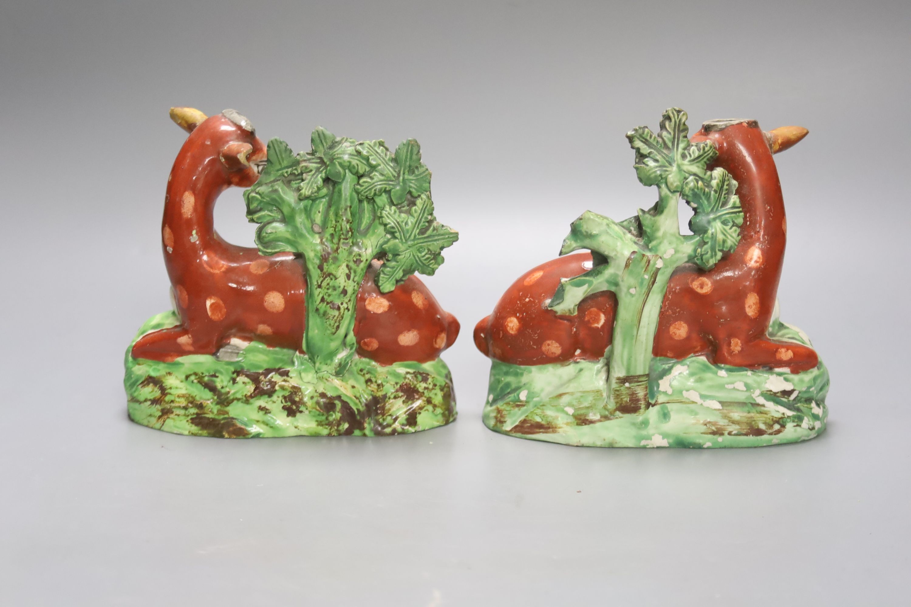 A pair of early 19th century Staffordshire models of deer